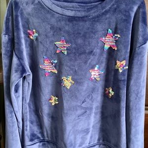 Girl’s size 10/12 velour top with sequin stars